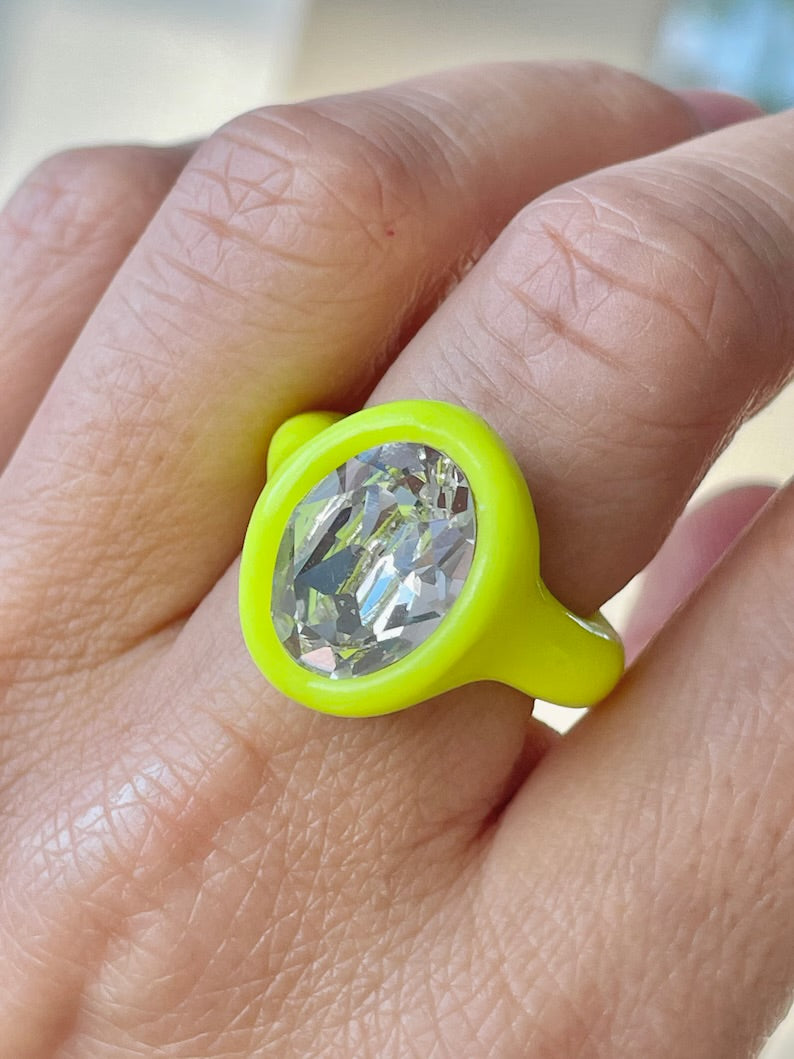 Neon yellow polymer ring with clear oval crystal 14mm