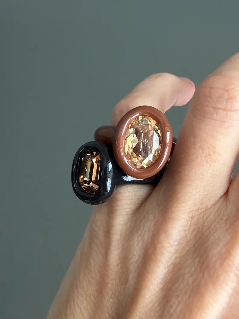 Espresso brown polymer ring with champagne crystal in oval shape