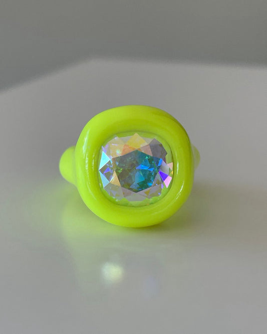 Neon yellow polymer ring with opalescent 12 mm crystal