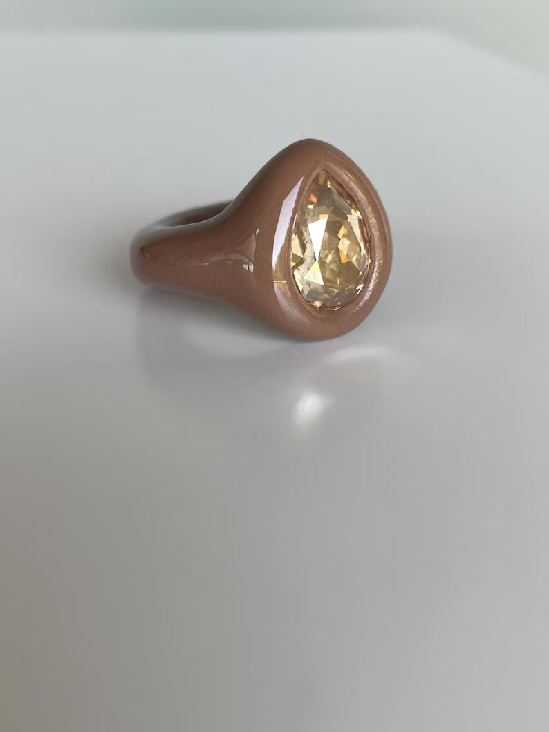 Soft beige ring with golden topaz crystal in pear shape