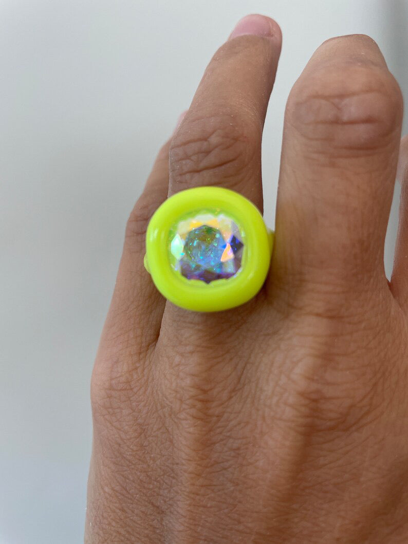 Neon yellow polymer ring with opalescent 12 mm crystal