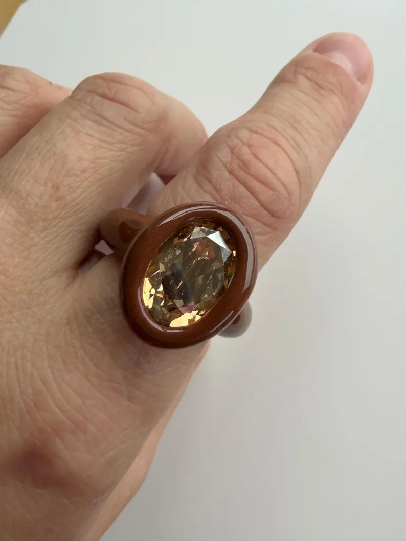 Espresso brown polymer ring with champagne crystal in oval shape