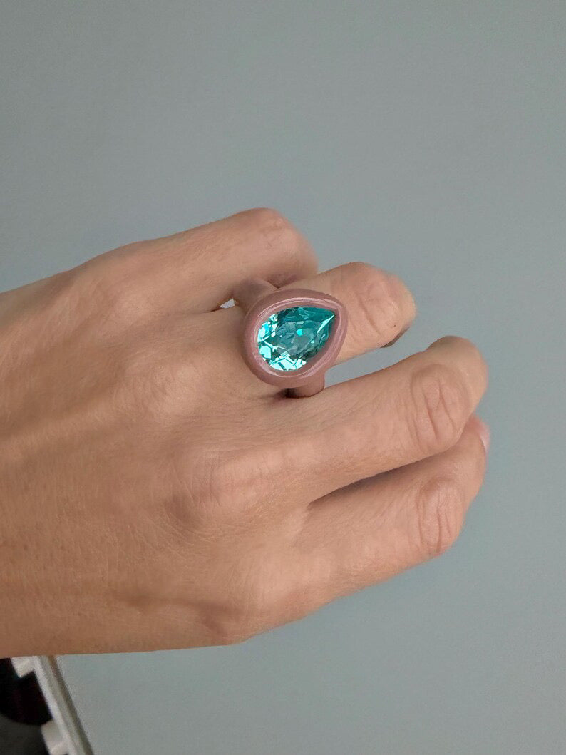 Brown beige ring with paraiba turquoise color pear shape crystal