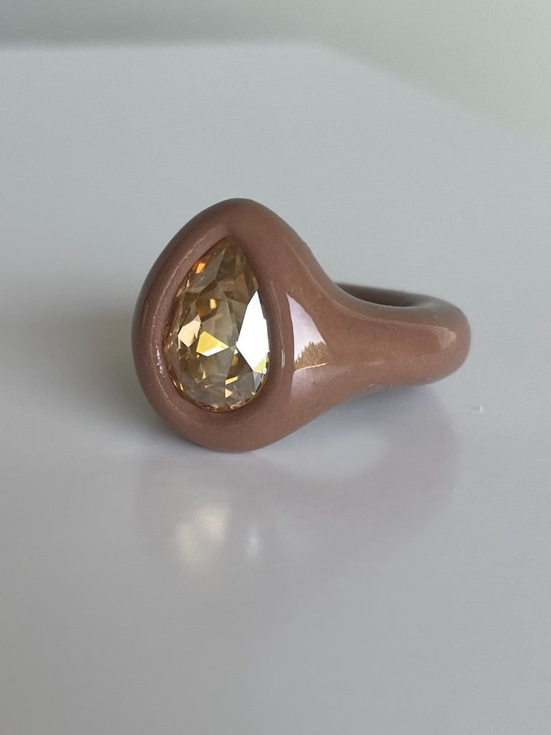Soft beige ring with golden topaz crystal in pear shape