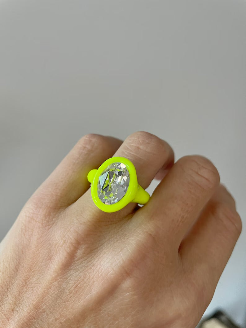 Neon yellow polymer ring with clear oval crystal 14mm