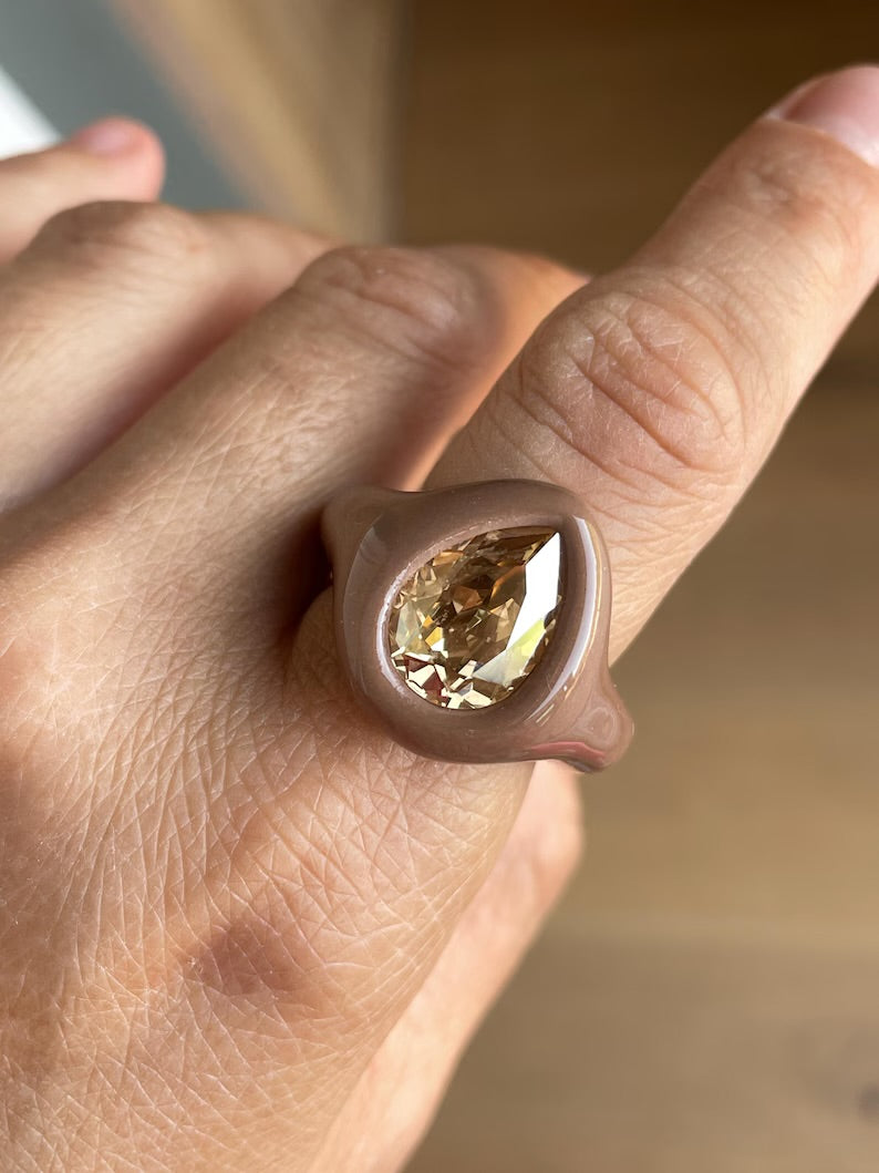 Soft beige ring with golden topaz crystal in pear shape