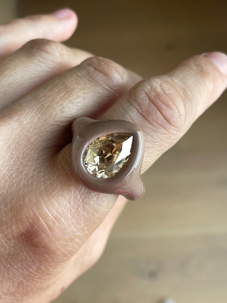 Soft beige ring with golden topaz crystal in pear shape