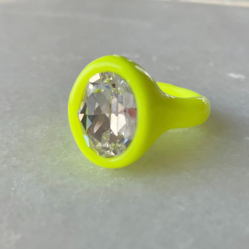 Neon yellow polymer ring with clear oval crystal 14mm