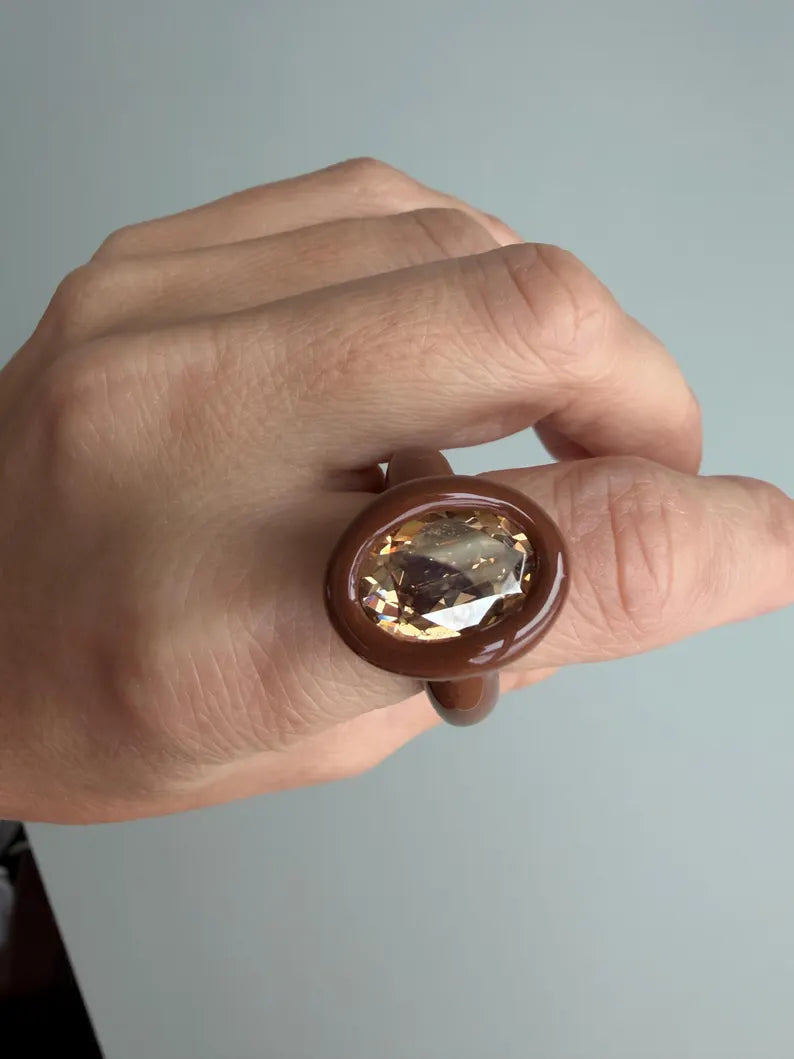 Espresso brown polymer ring with champagne crystal in oval shape