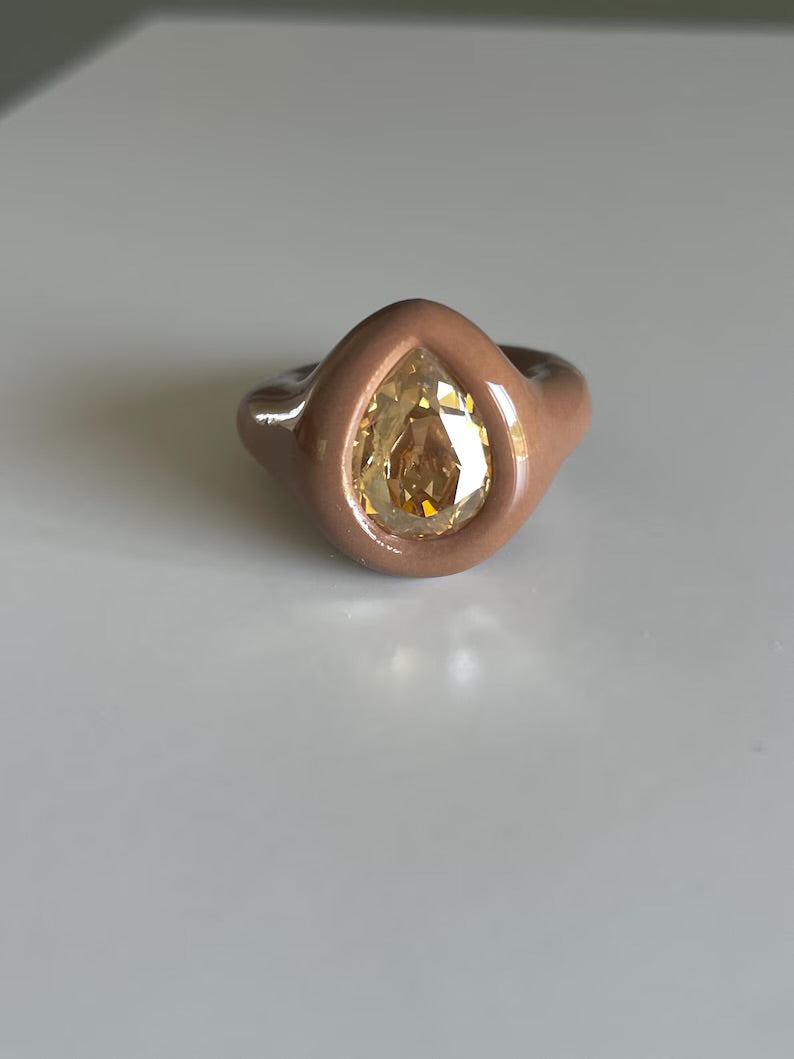 Soft beige ring with golden topaz crystal in pear shape