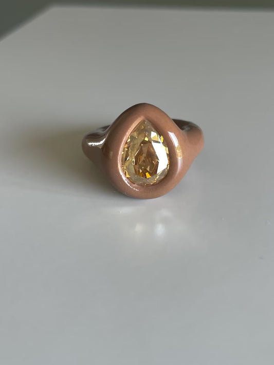 Soft beige ring with golden topaz crystal in pear shape
