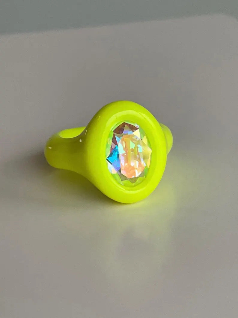 Neon yellow polymer ring with iridescent oval crystal 14mm