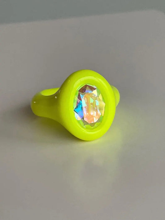 Neon yellow polymer ring with iridescent oval crystal 14mm