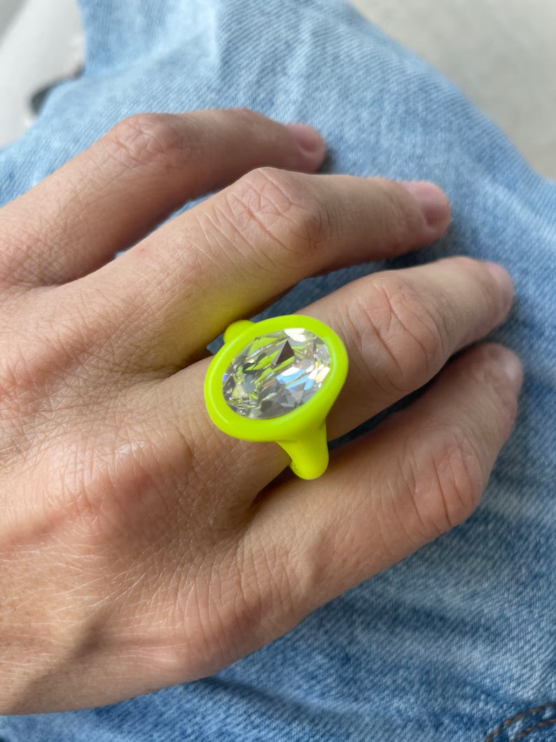 Neon yellow polymer ring with clear oval crystal 14mm