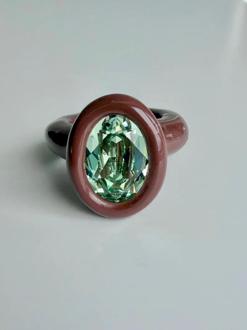 Espresso brown polymer ring with green oval crystal