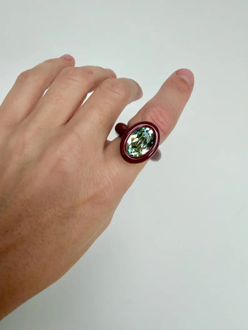 Espresso brown polymer ring with green oval crystal