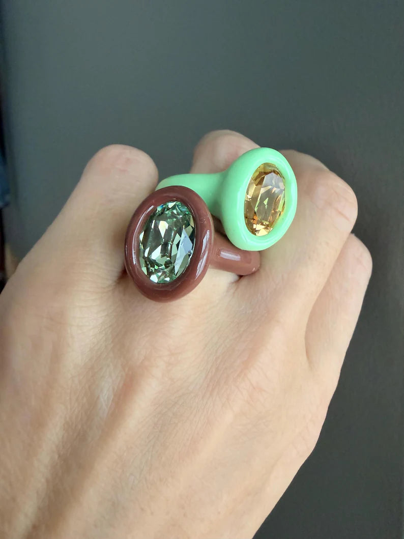 Espresso brown polymer ring with green oval crystal
