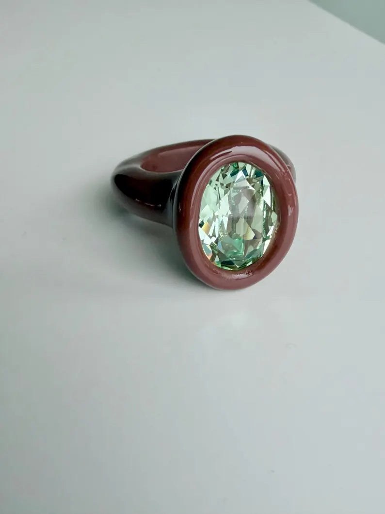 Espresso brown polymer ring with green oval crystal
