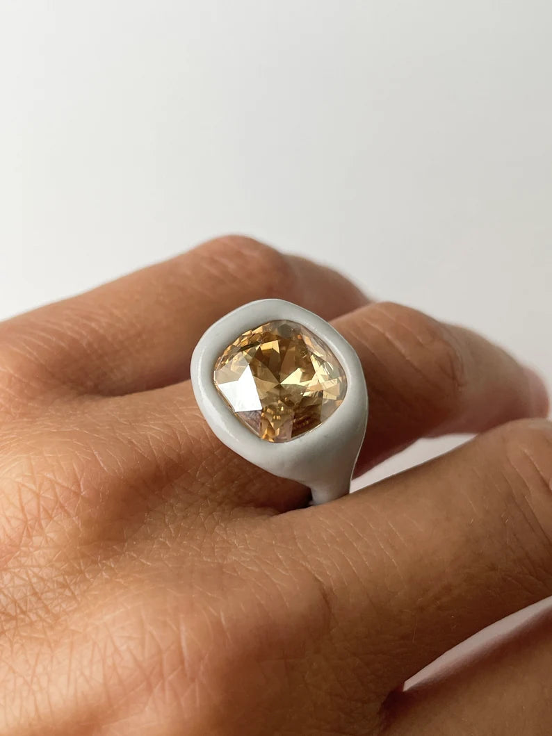 Gray polymer ring with cushion champagne diamond crystal