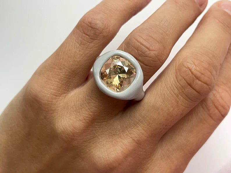Gray polymer ring with cushion champagne diamond crystal